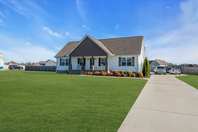 a front view of a house with a yard table and chairs