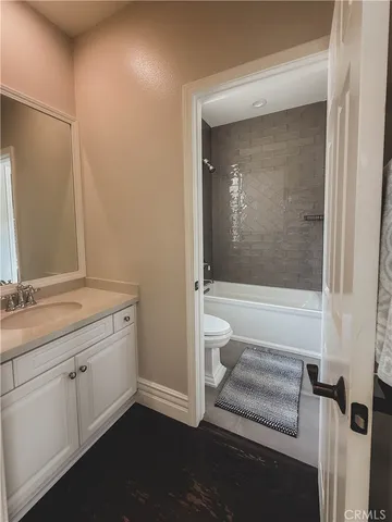 a bathroom with a double vanity sink and mirror