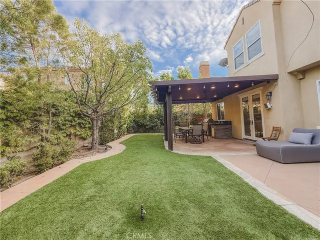 a view of yard with patio