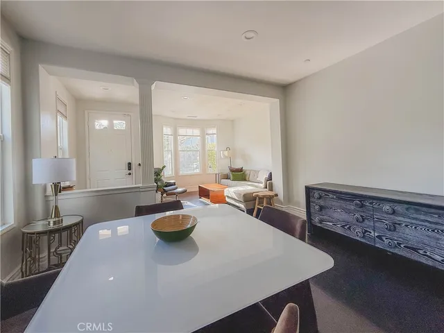 a very nice looking dining room with a table and chairs