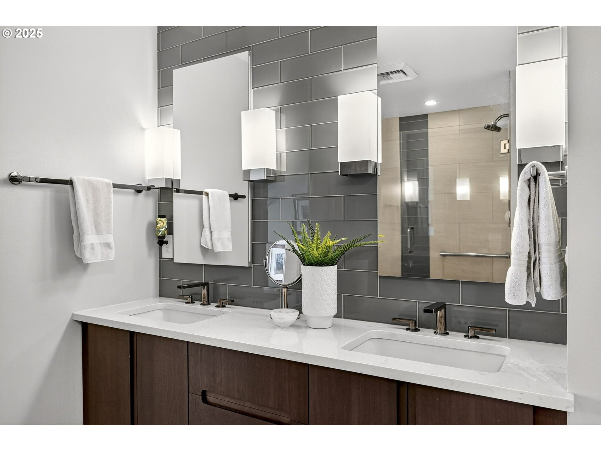 2448 Northwest Westover Road, Unit E402 Portland, OR 97210 - Photo 16 of 31 a bathroom with a sink and a mirror