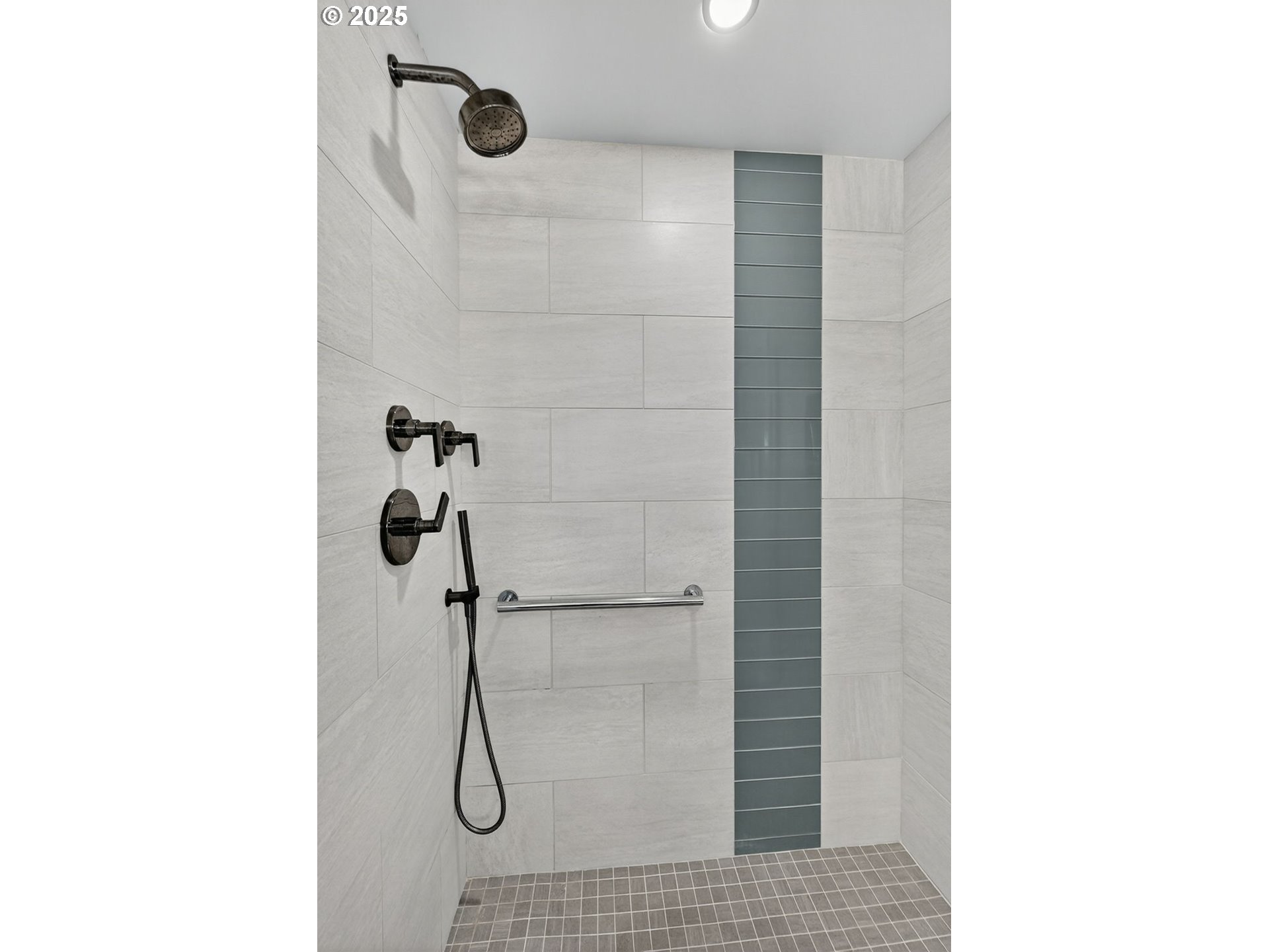 2448 Northwest Westover Road, Unit E402 Portland, OR 97210 - Photo 17 of 31 a bathroom with a shower