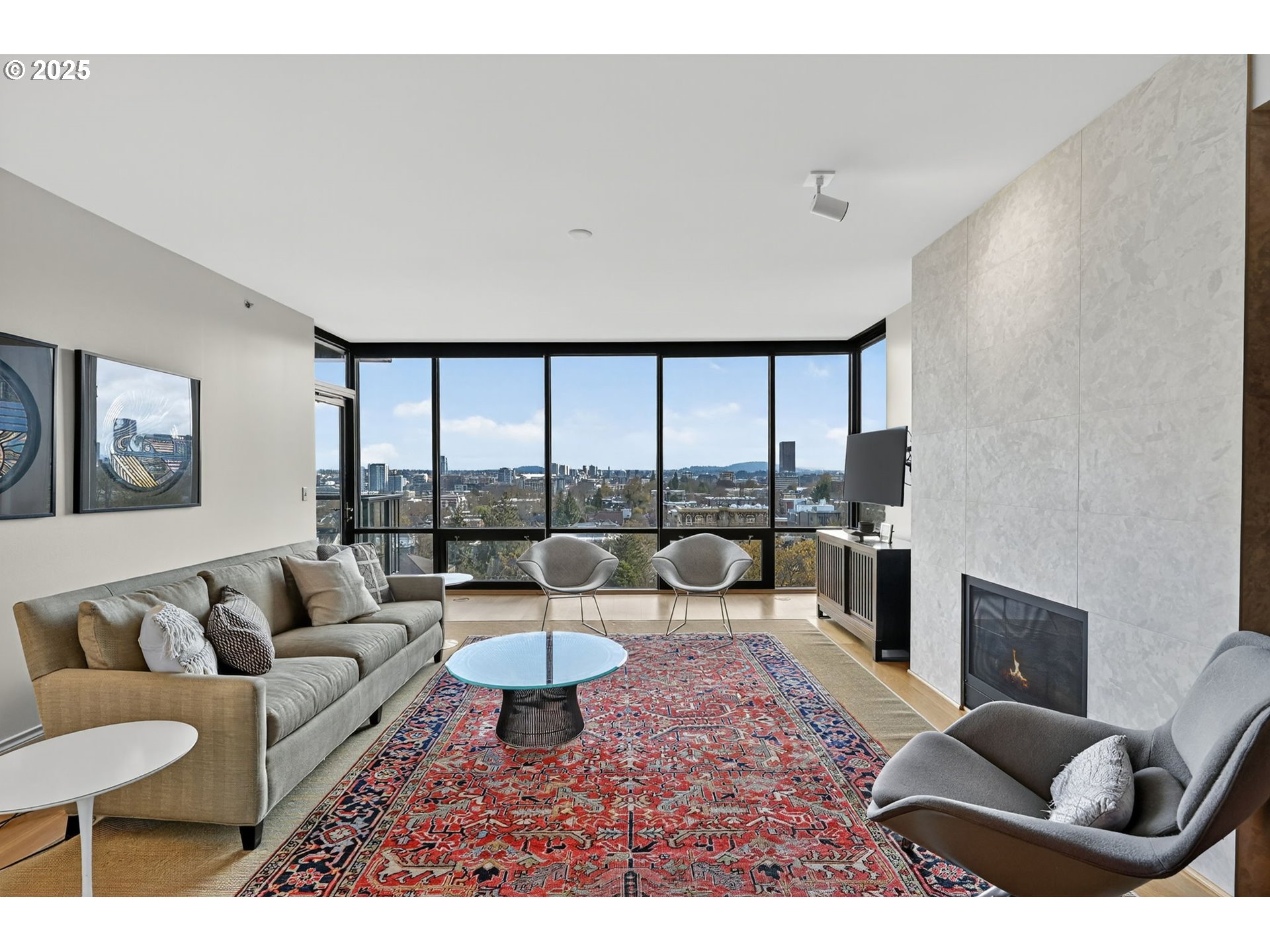 2448 Northwest Westover Road, Unit E402 Portland, OR 97210 - Photo 4 of 31 a living room with furniture and a large window