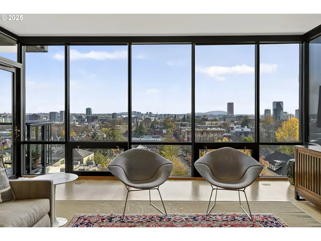 a balcony with wooden floor and outdoor seating