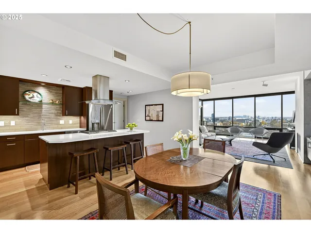 a dining room with furniture and window