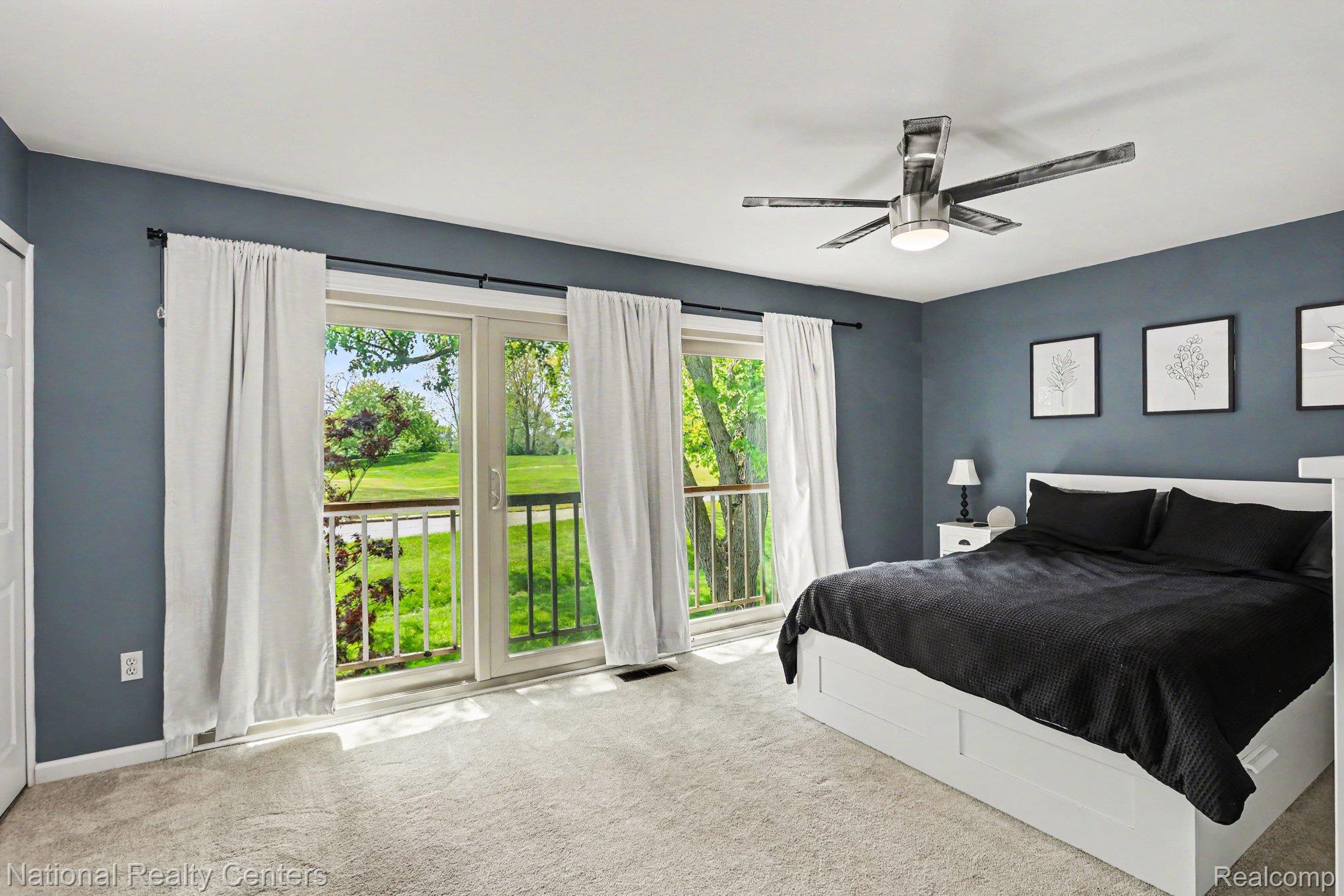753 Oak Brook Ridge Drive Rochester, MI 48307 - Photo 12 of 18 Bedroom with carpet flooring, multiple windows, and a ceiling fan