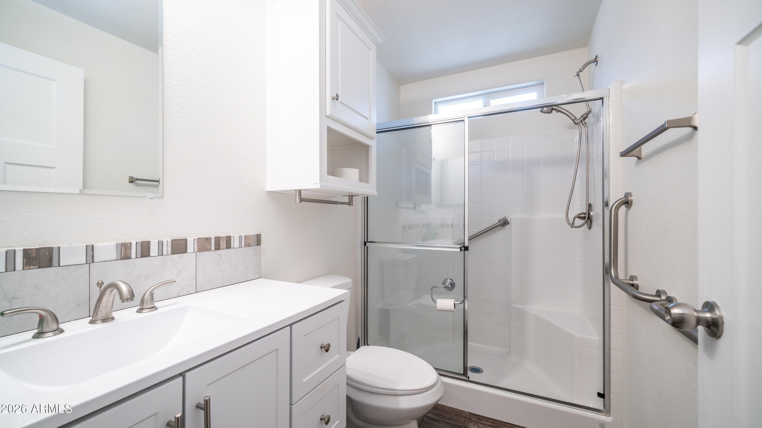 2929 East Main Street, Unit 237 Mesa, AZ 85213 - Photo 14 of 20 a bathroom with a sink toilet vanity and shower