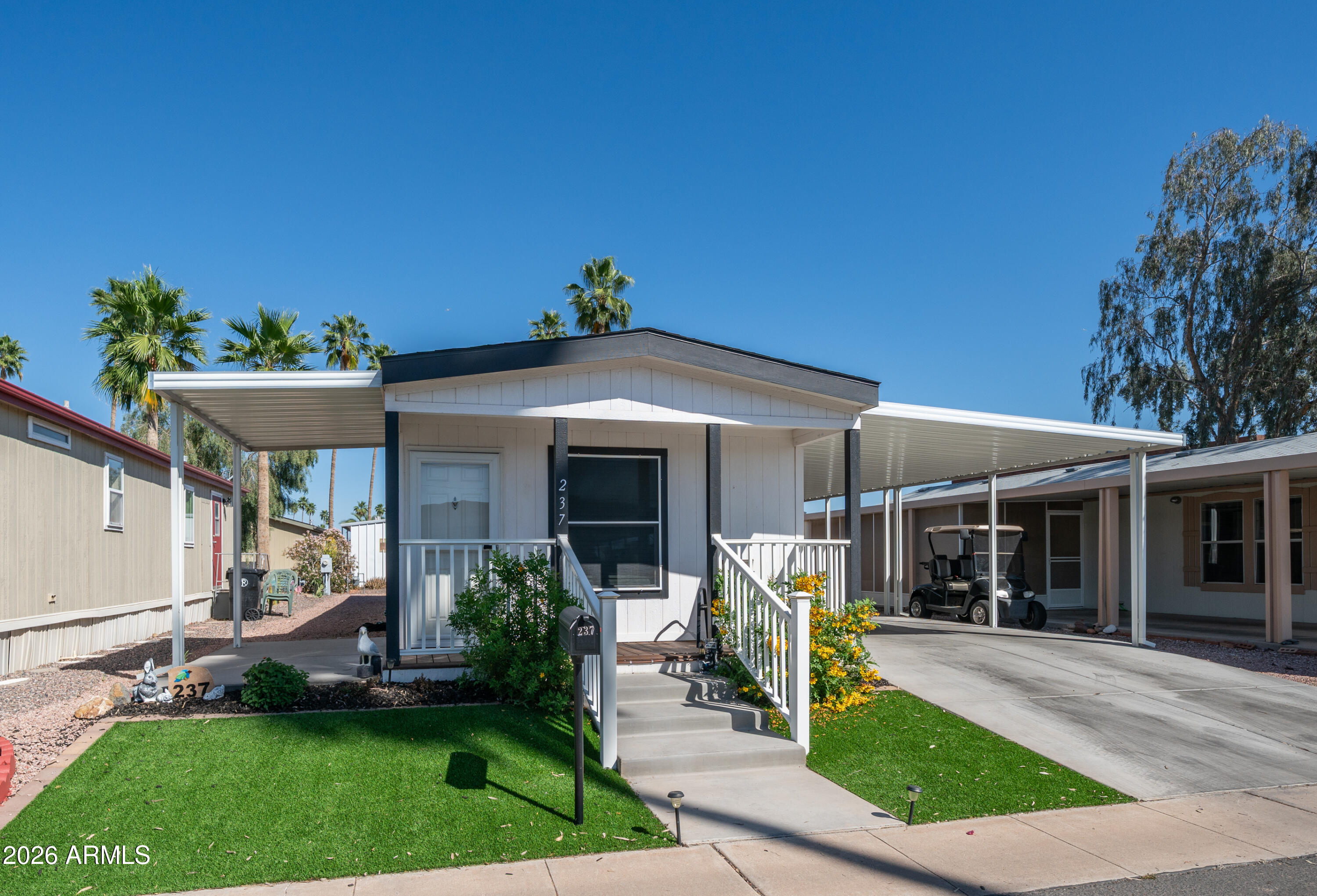 2929 East Main Street, Unit 237 Mesa, AZ 85213 - Photo 3 of 20 a view of a house with garden