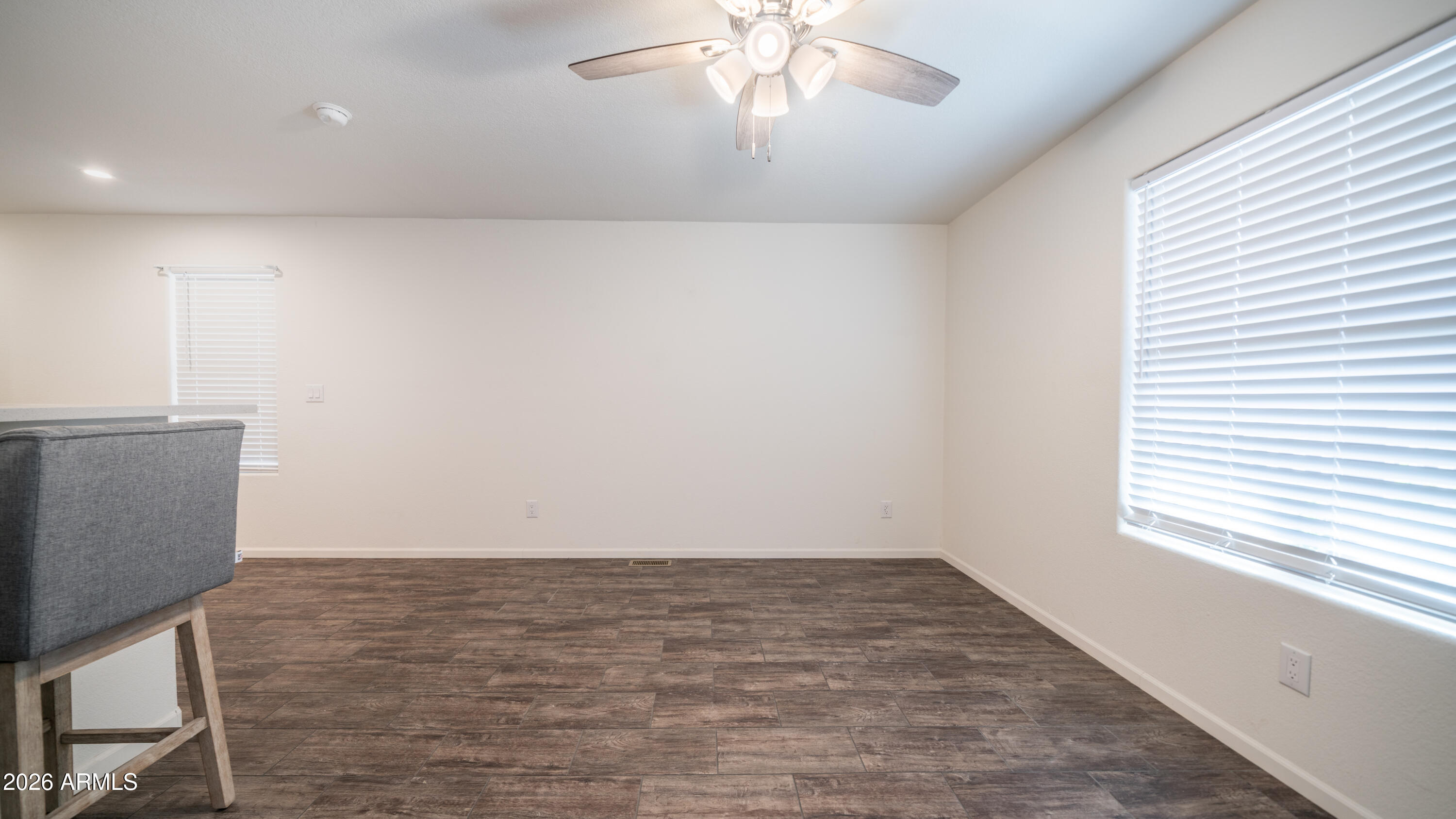 2929 East Main Street, Unit 237 Mesa, AZ 85213 - Photo 5 of 20 wooden floor in an empty room with a window