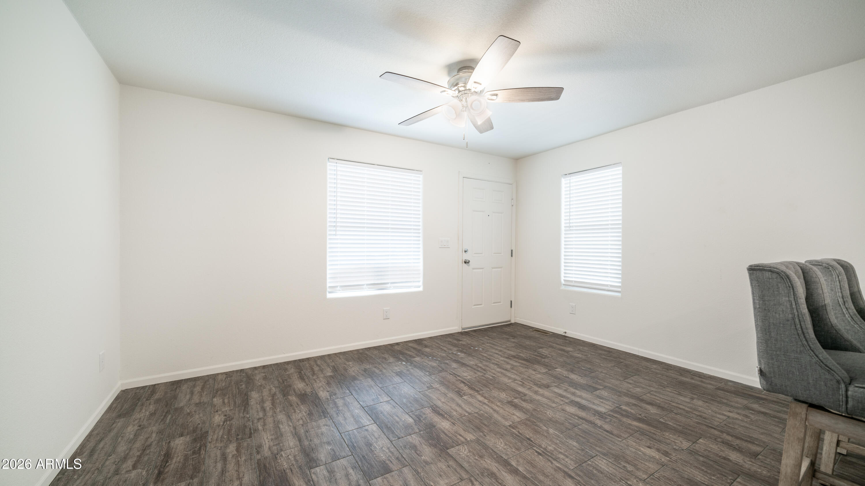 2929 East Main Street, Unit 237 Mesa, AZ 85213 - Photo 6 of 20 wooden floor in an empty room with a window