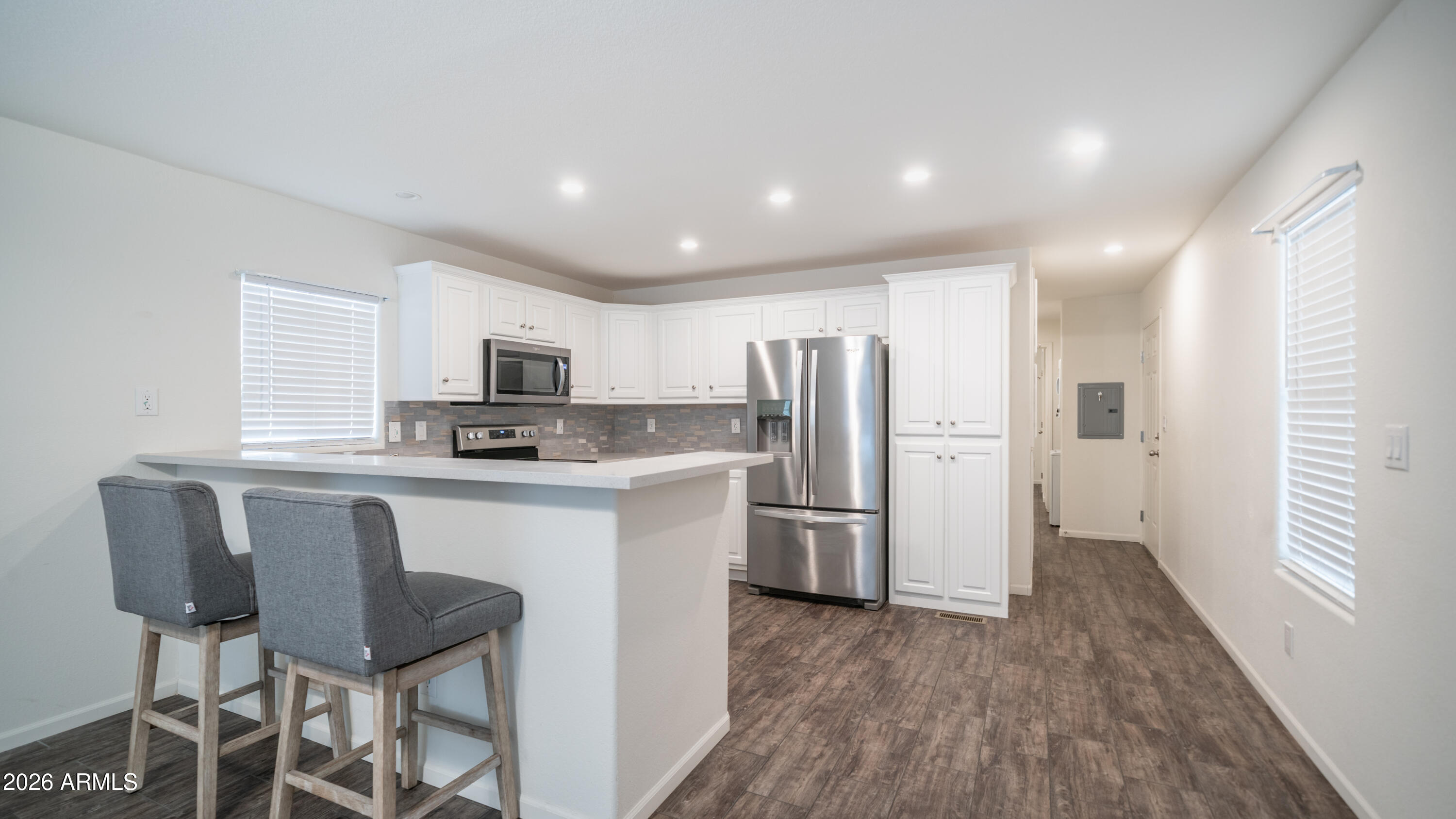 2929 East Main Street, Unit 237 Mesa, AZ 85213 - Photo 7 of 20 a kitchen with refrigerator and window
