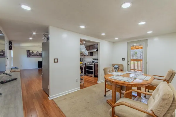 a room with furniture and a flat screen tv