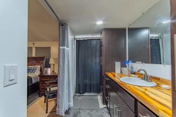 a bathroom with a sink and a mirror