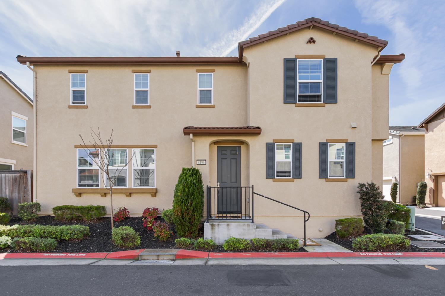 8196 Kramer Ranch Way Elk Grove, CA 95758 - Photo 2 of 47 a front view of a house with a yard and garage