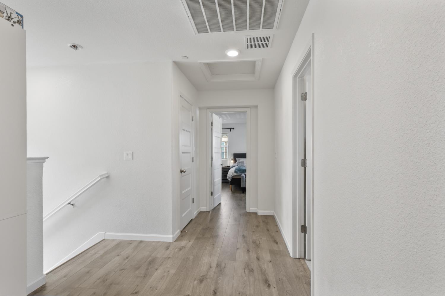 8196 Kramer Ranch Way Elk Grove, CA 95758 - Photo 21 of 47 a view of a hallway with wooden floor