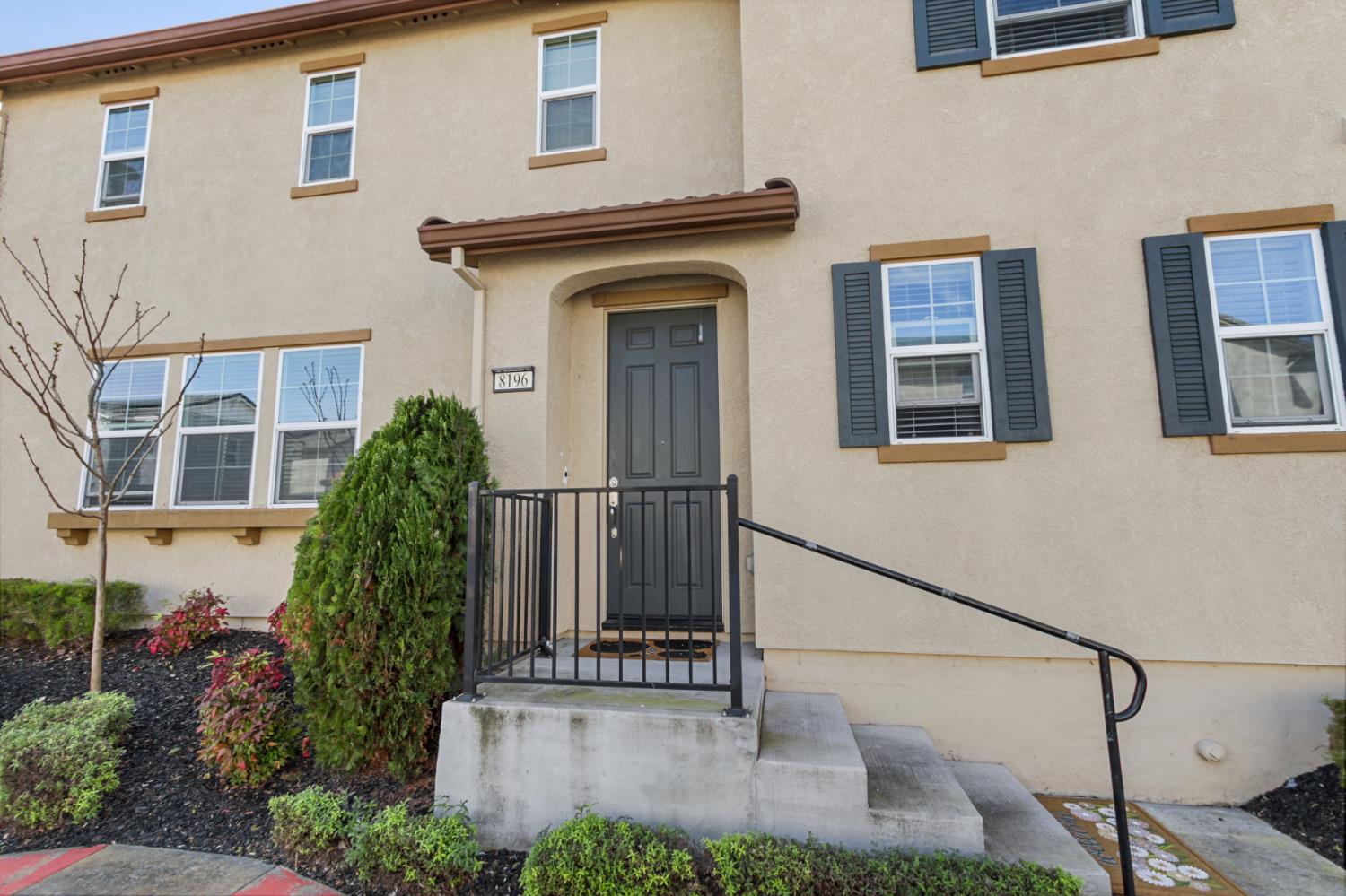 8196 Kramer Ranch Way Elk Grove, CA 95758 - Photo 6 of 47 a view of a house with many windows and plants