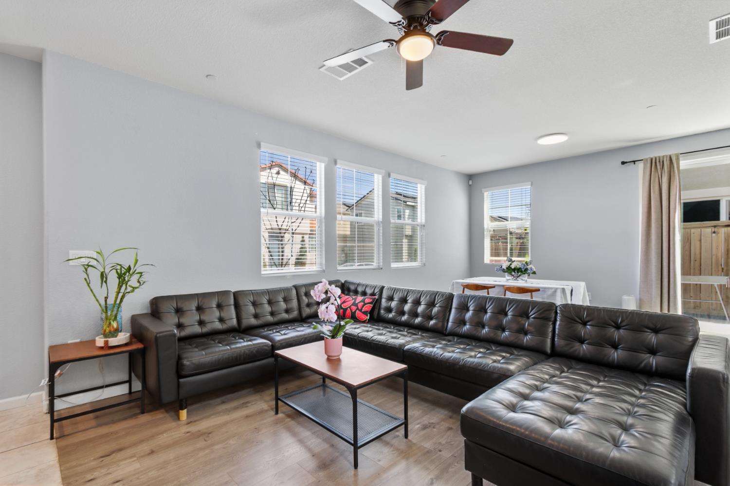 8196 Kramer Ranch Way Elk Grove, CA 95758 - Photo 9 of 47 a living room with furniture and a large window