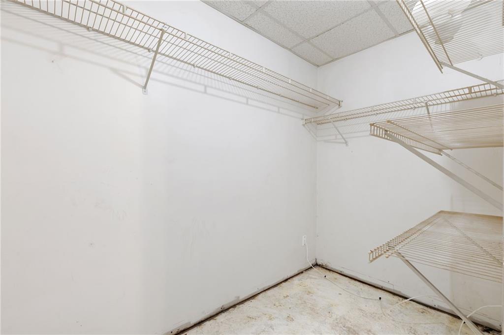 1303 Post Oak Court Winder, GA 30680 - Photo 12 of 25 a view of a room with racks on the wall