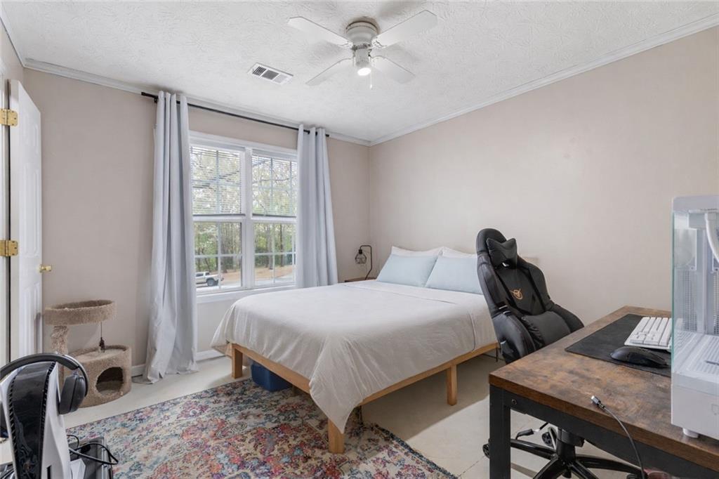 1303 Post Oak Court Winder, GA 30680 - Photo 13 of 25 a bedroom with a bed and two tables