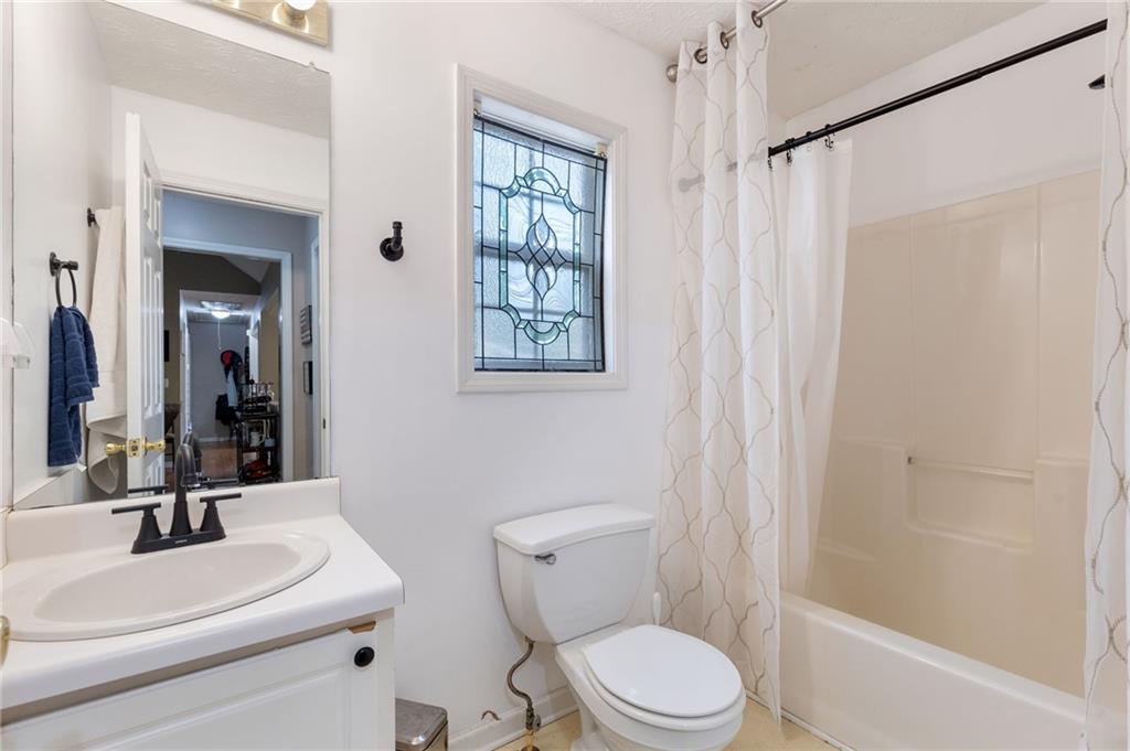 1303 Post Oak Court Winder, GA 30680 - Photo 14 of 25 a bathroom with a sink toilet and shower