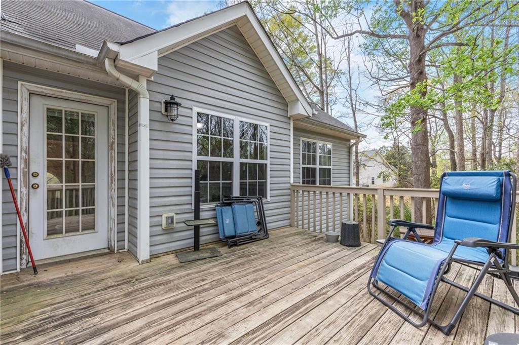 1303 Post Oak Court Winder, GA 30680 - Photo 17 of 25 a view of a deck with wooden floor and outdoor seating