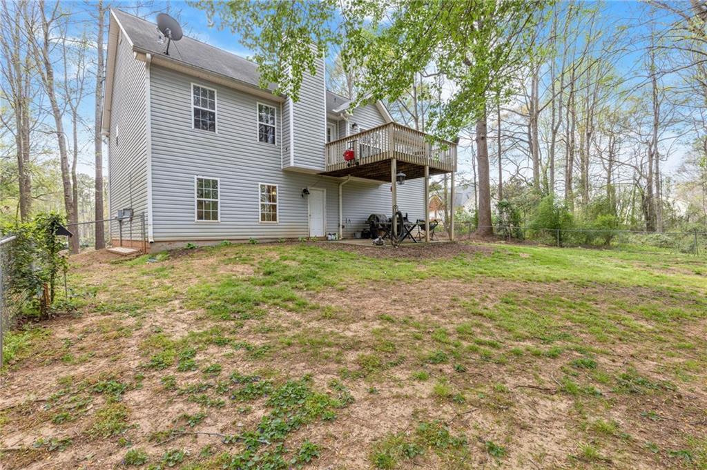 1303 Post Oak Court Winder, GA 30680 - Photo 19 of 25 a view of a house with a yard