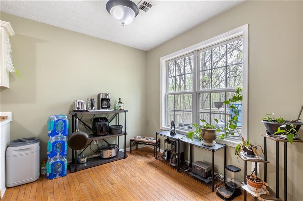 1303 Post Oak Court Winder, GA 30680 - Photo 7 of 25 a view of a workspace with furniture and a window
