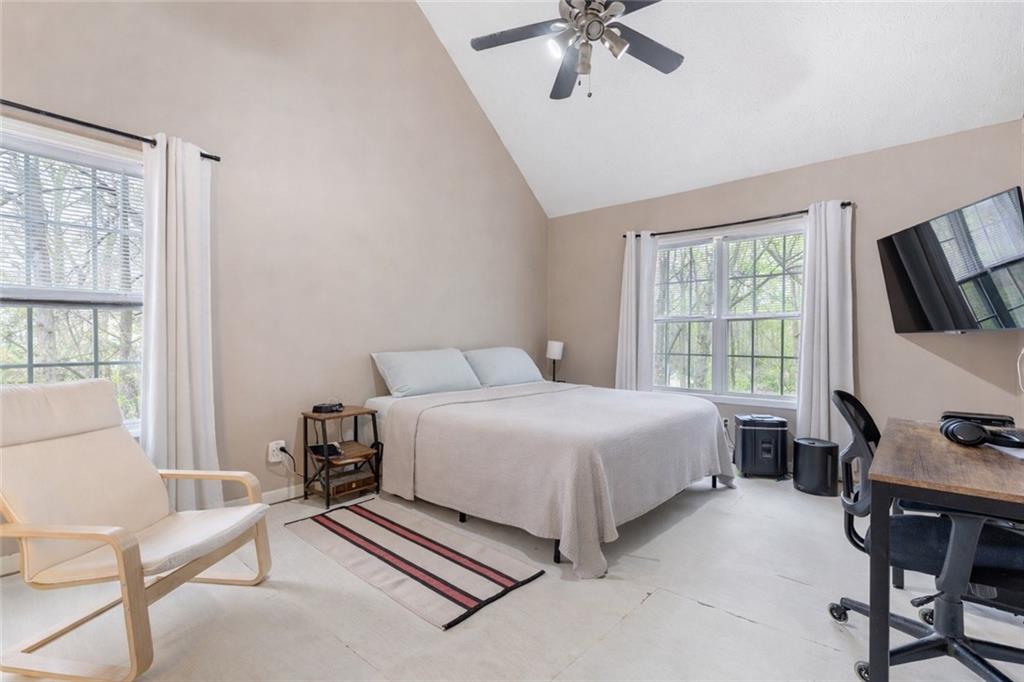 1303 Post Oak Court Winder, GA 30680 - Photo 9 of 25 a bedroom with a bed furniture and a flat screen tv