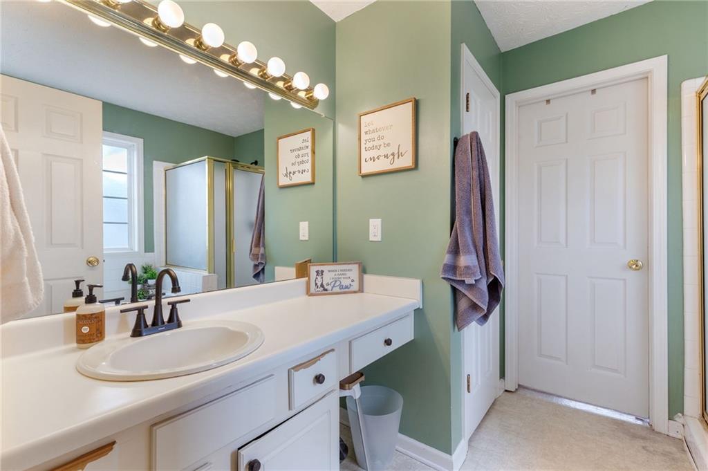 1303 Post Oak Court Winder, GA 30680 - Photo 10 of 25 a bathroom with a sink double vanity and a mirror
