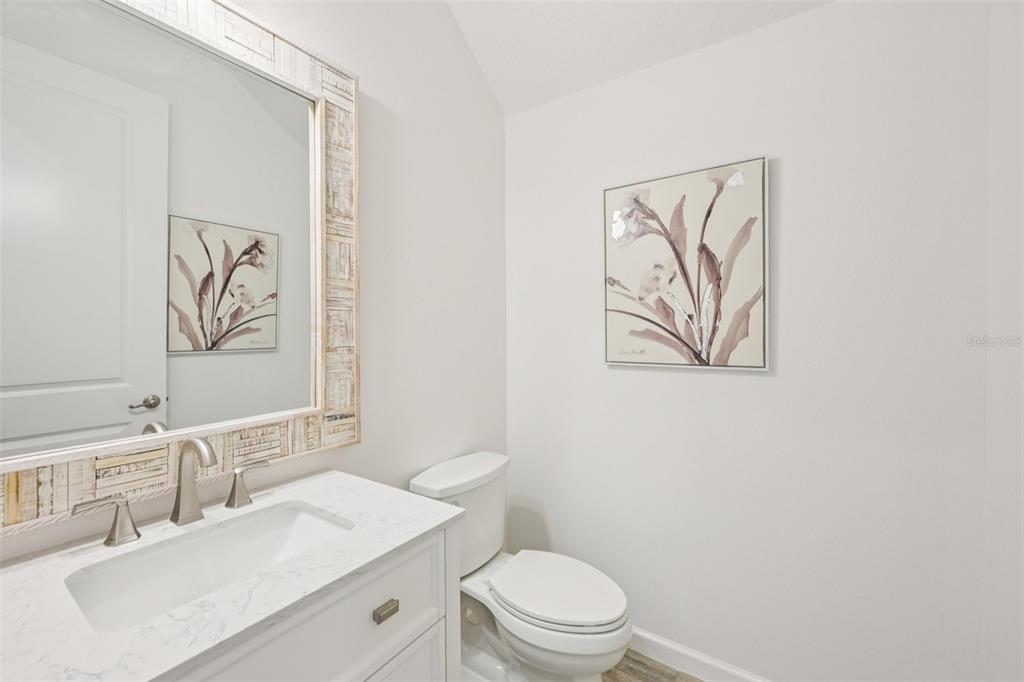 806 Winterside Drive Apollo Beach, FL 33572 - Photo 15 of 57 a bathroom with a toilet a sink and mirror