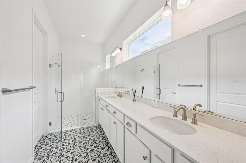 806 Winterside Drive Apollo Beach, FL 33572 - Photo 17 of 57 a bathroom with a sink a toilet and shower
