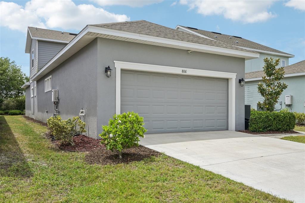 806 Winterside Drive Apollo Beach, FL 33572 - Photo 2 of 57 a front view of a house with garden