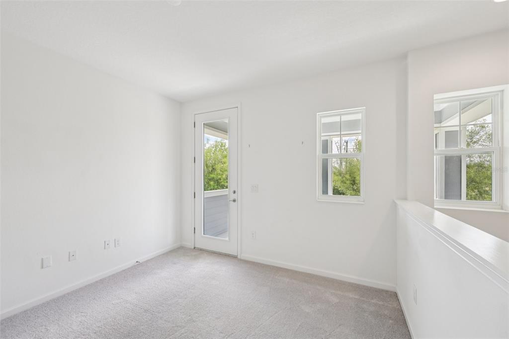 806 Winterside Drive Apollo Beach, FL 33572 - Photo 25 of 57 an empty room with windows