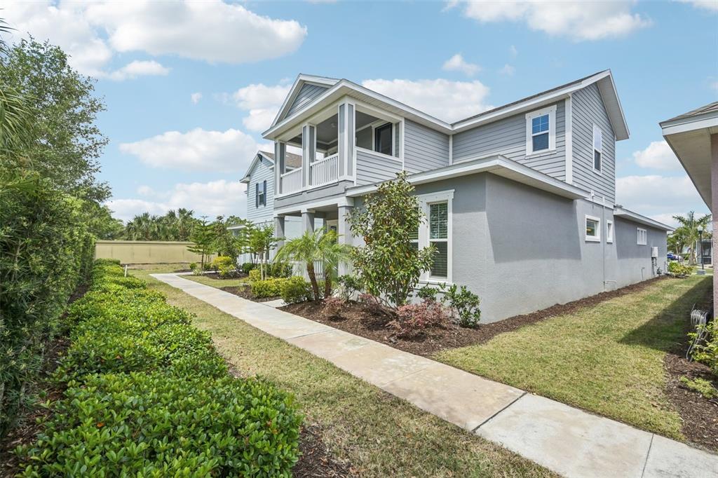 806 Winterside Drive Apollo Beach, FL 33572 - Photo 41 of 57 a front view of a house with a yard and potted plants