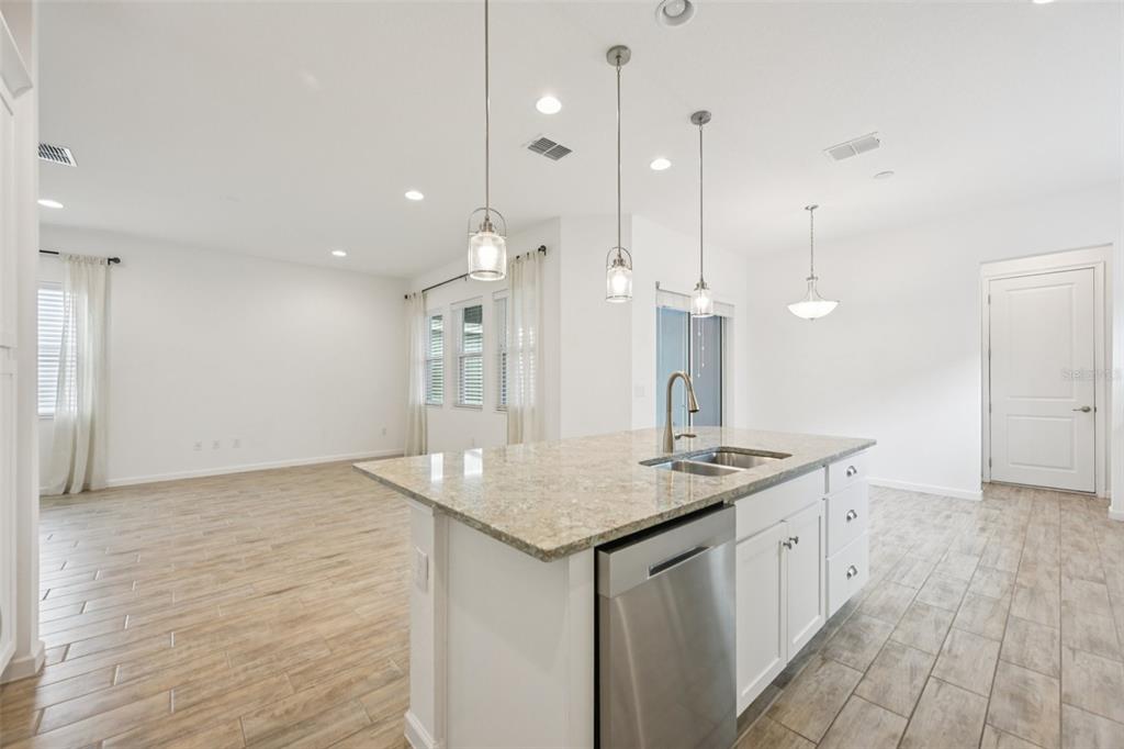806 Winterside Drive Apollo Beach, FL 33572 - Photo 10 of 57 a kitchen with a sink a counter space and a refrigerator
