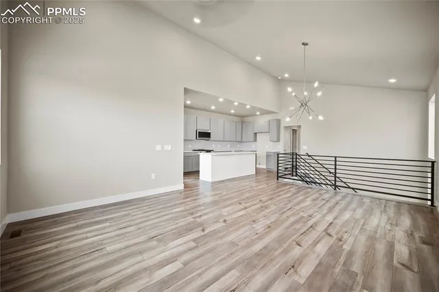 a view of kitchen with wooden floor