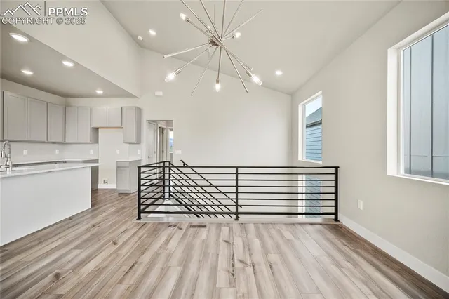 a view of a room with kitchen appliances and windows