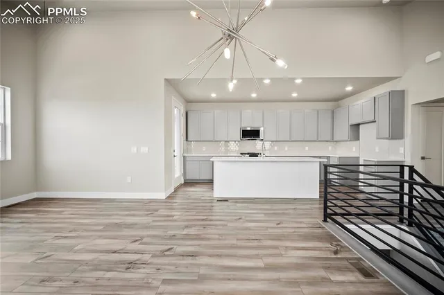 a view of kitchen with wooden floor