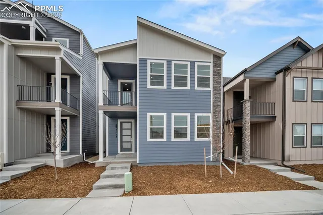 a view of a house with brick walls
