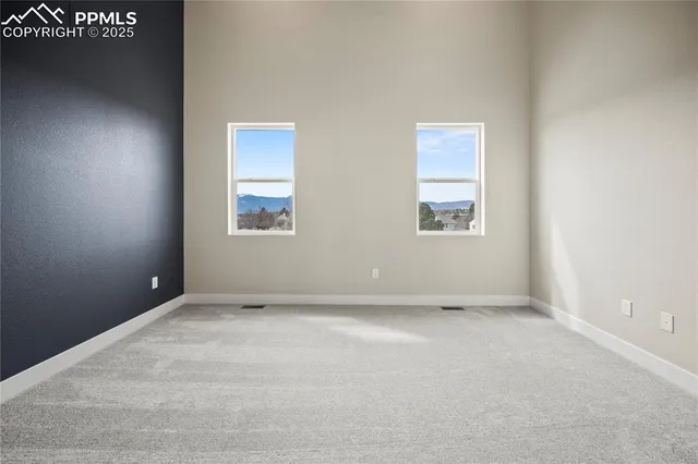 an empty room with windows