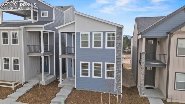a view of a house with a door and balcony