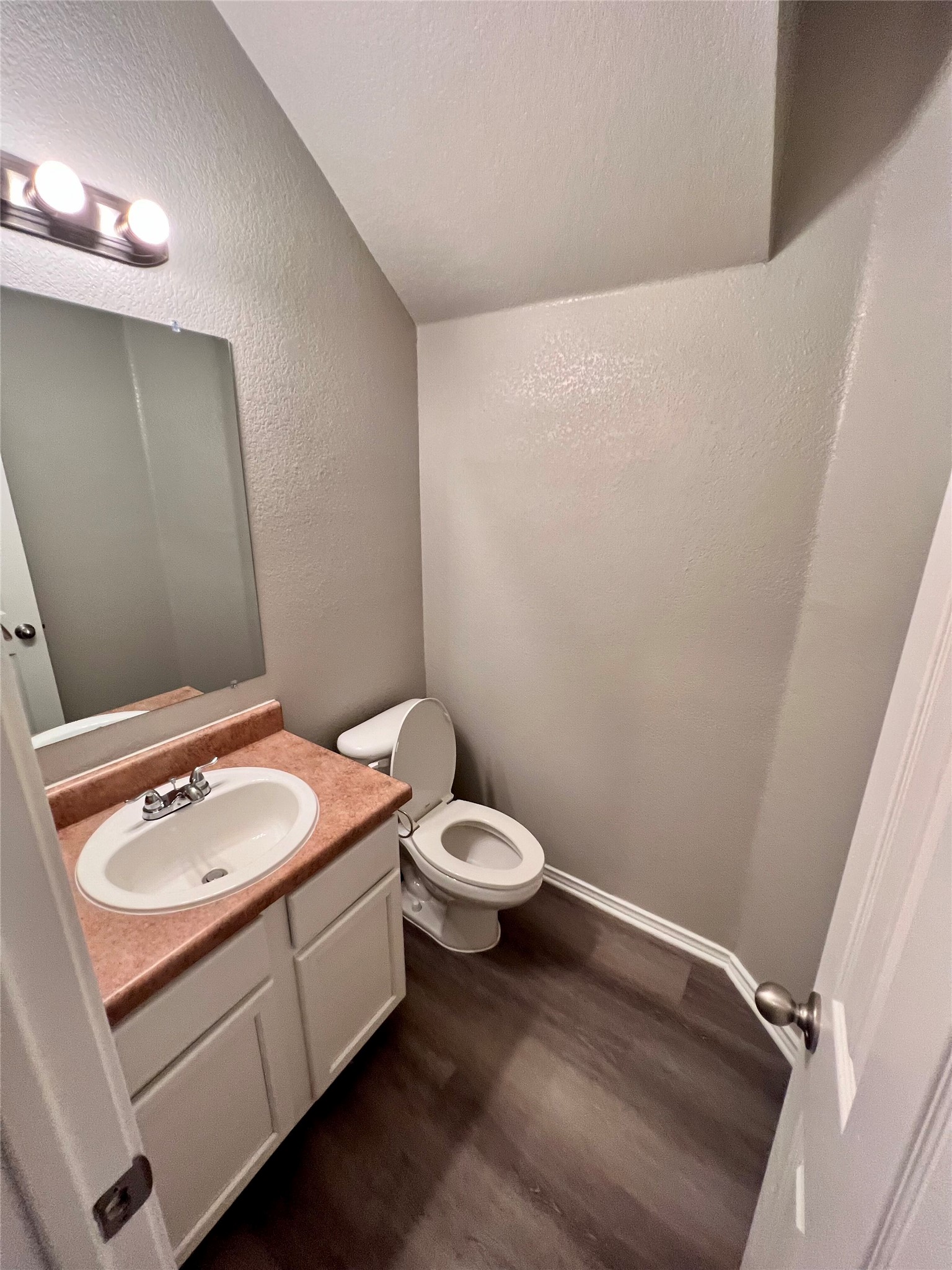 1801 Constantino Circle Austin, TX 78745 - Photo 8 of 22 a bathroom with a sink toilet and vanity