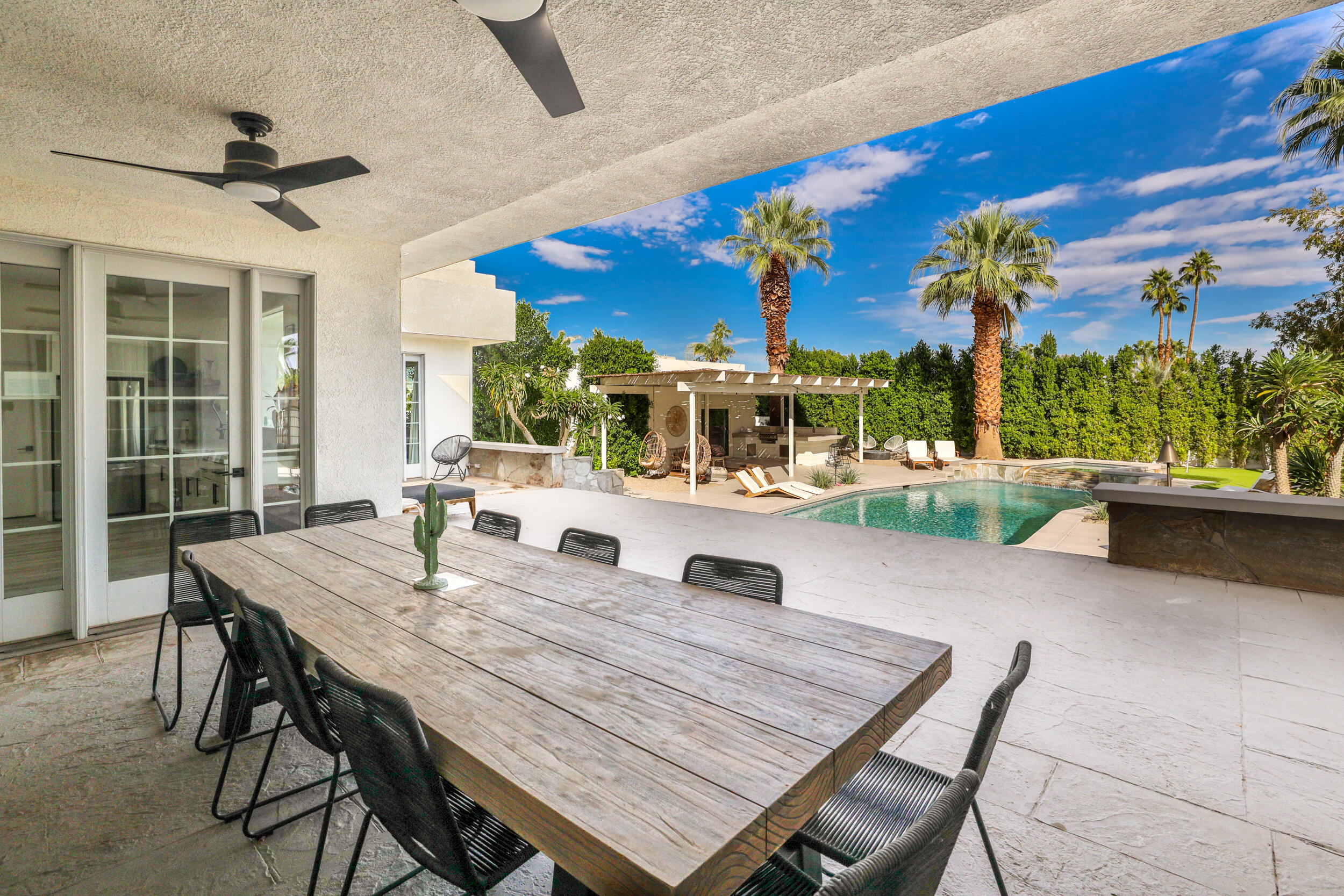 71468 Mirage Road Rancho Mirage, CA 92270 - Photo 54 of 78 a outdoor dining space with furniture and a potted plant