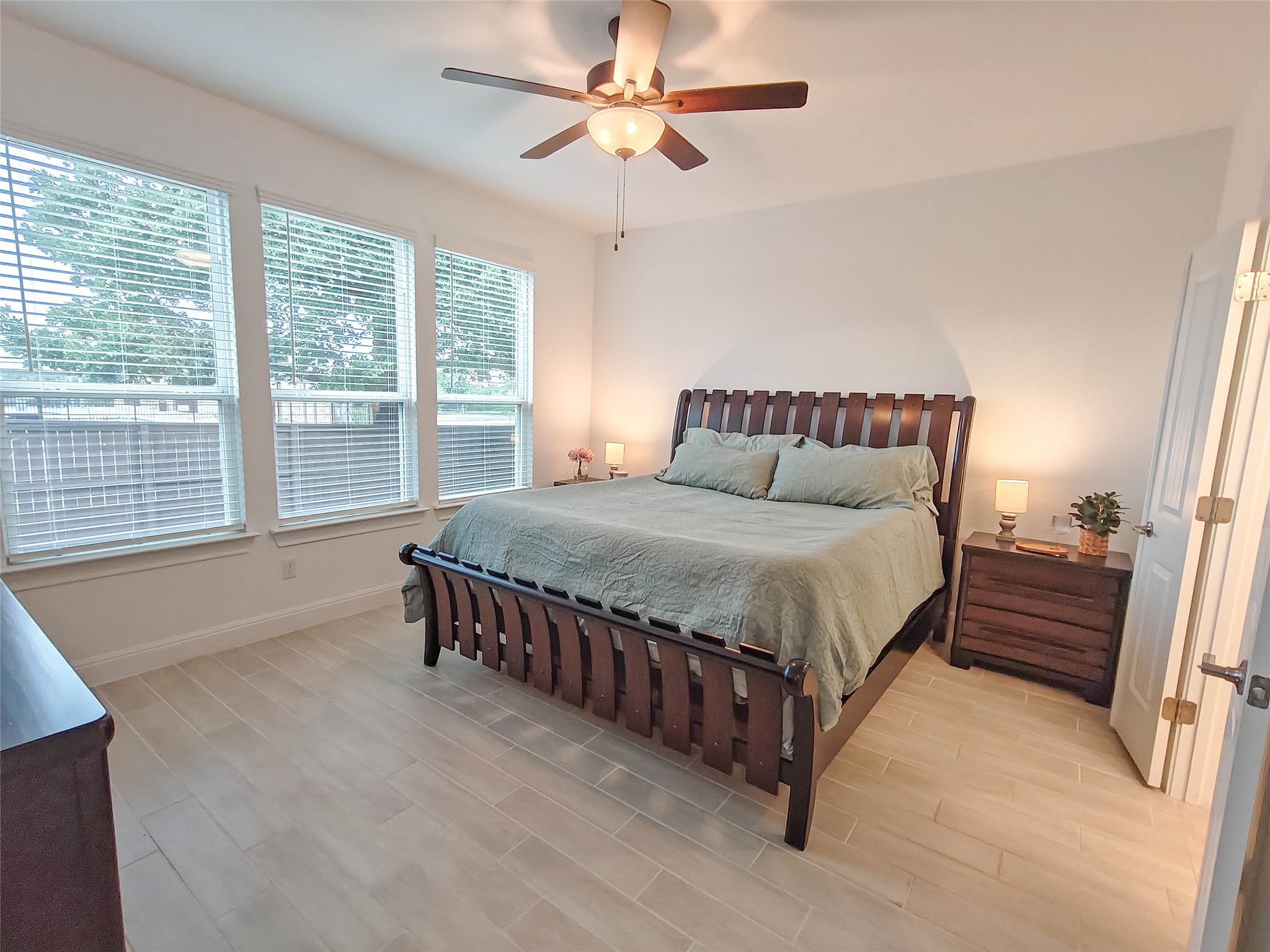 200 Fiddleneck Road Marble Falls, TX 78654 - Photo 12 of 37 a bed sitting in a bedroom next to a window