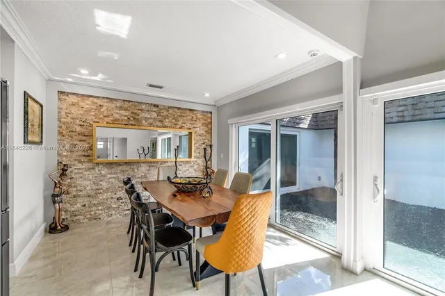 a dining room with furniture and window