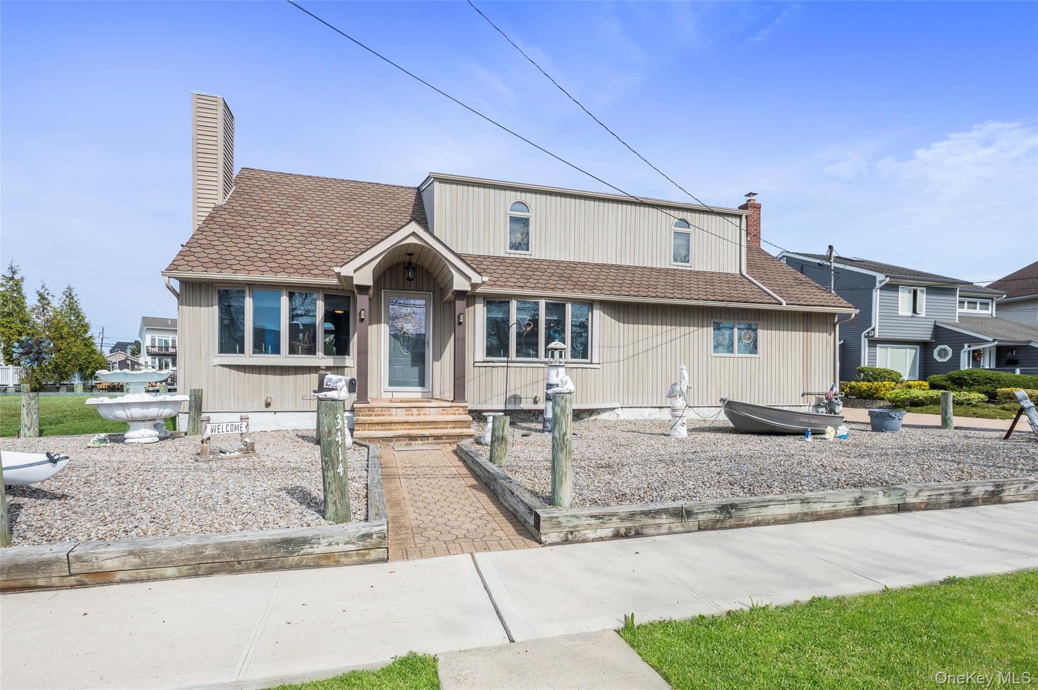 3414 Riverside Drive Oceanside, NY 11572 - Photo 1 of 26 Front of house has 2 huge driveways