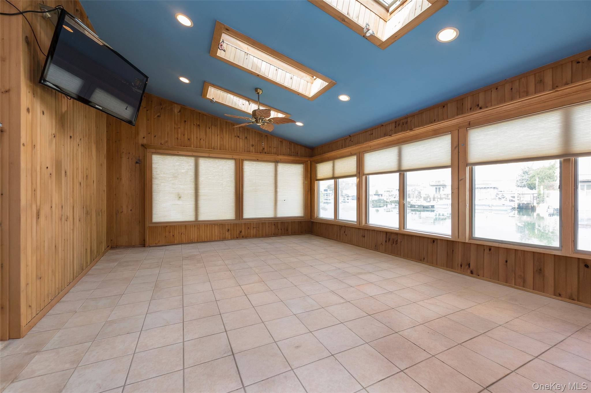 3414 Riverside Drive Oceanside, NY 11572 - Photo 12 of 26 Huge sunroom with stunning water views - split unit provides heating and cooling