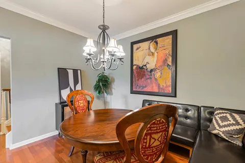 a dining room with furniture a livingroom and wooden floor