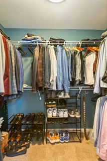a bathroom with a granite countertop sink a mirror and a bathtub