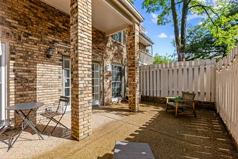 a backyard of a house with outdoor seating